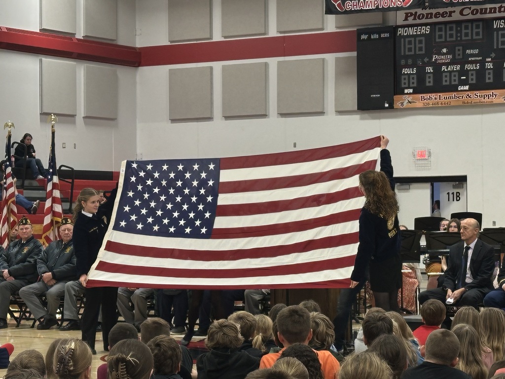studentns holding up the flag