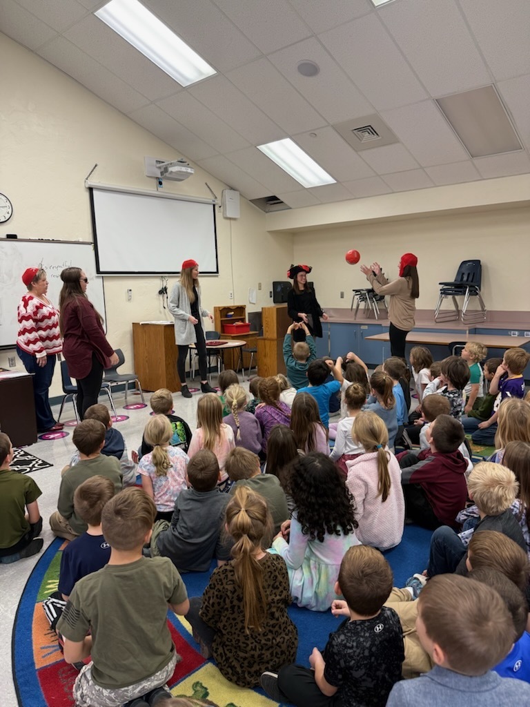 first grade teachers dressed as pirates talking to 1st graders