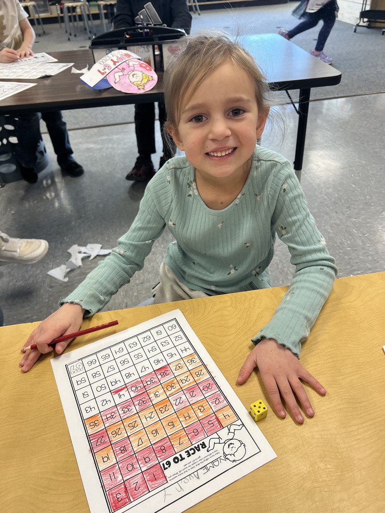 One student coloring a worksheet
