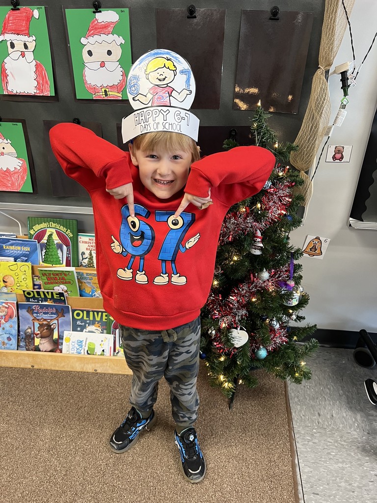 student wearing a 67 shirt