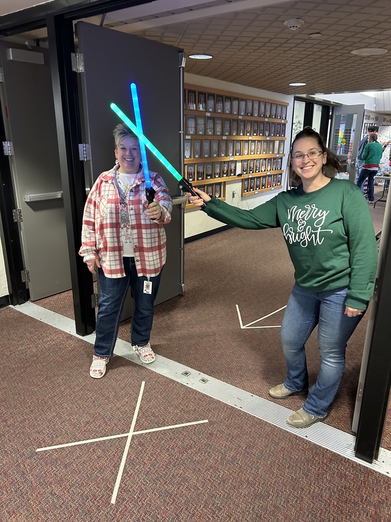2 teachers with light sabers