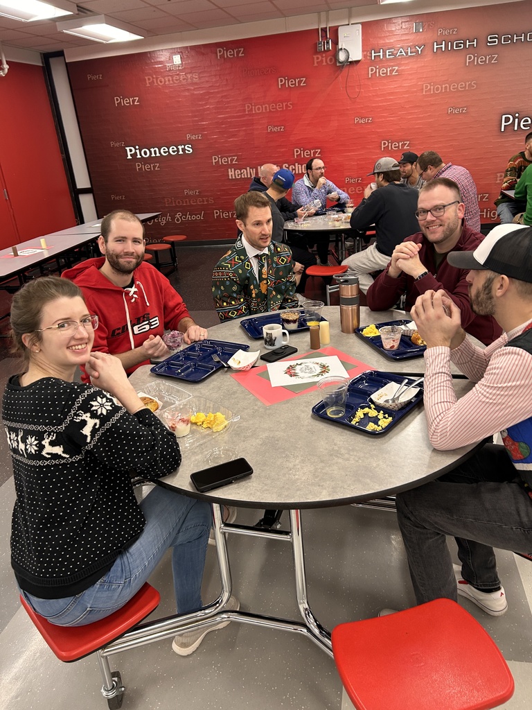 teachers looking at camera eating breakfast