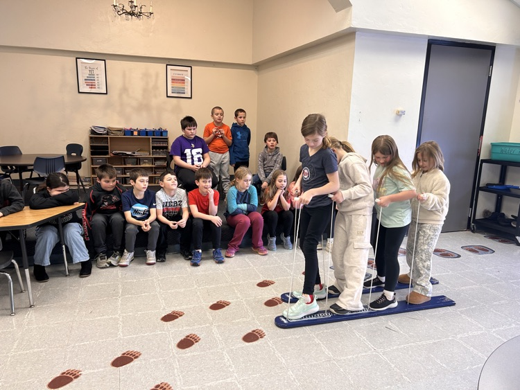 Students walking on skis for cooperative walking
