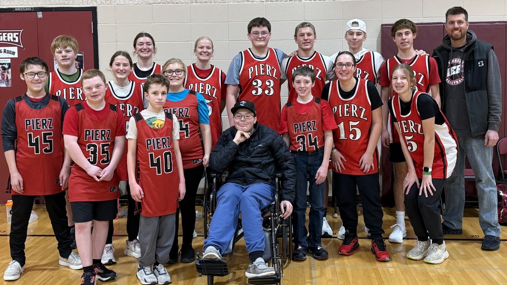 United Team in red jerseys looking at camera