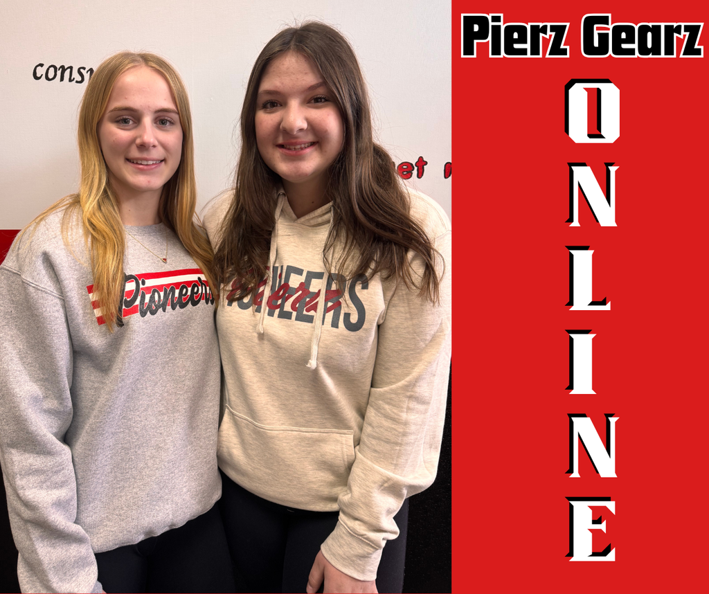 2 girls wearing pioneer sweatshirts looking at camera and smiling