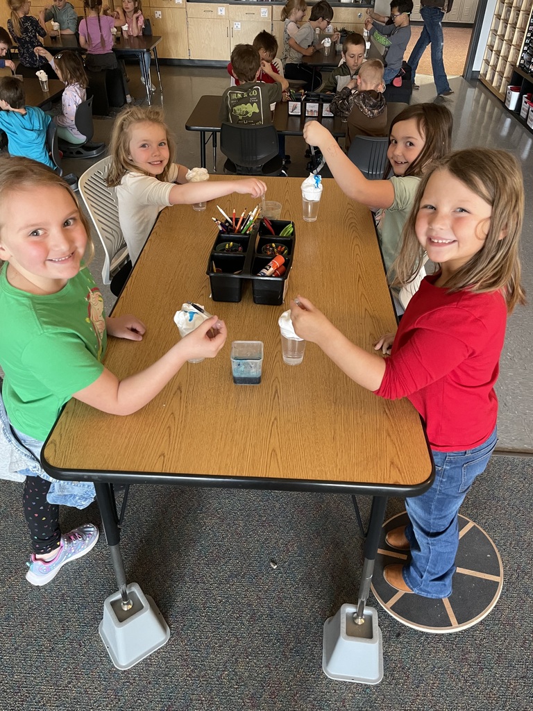 group of children creating storm jars