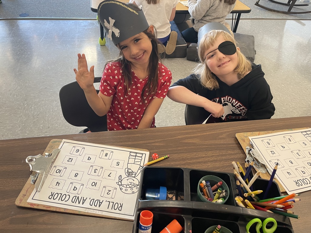 2 girls working on a worksheet
