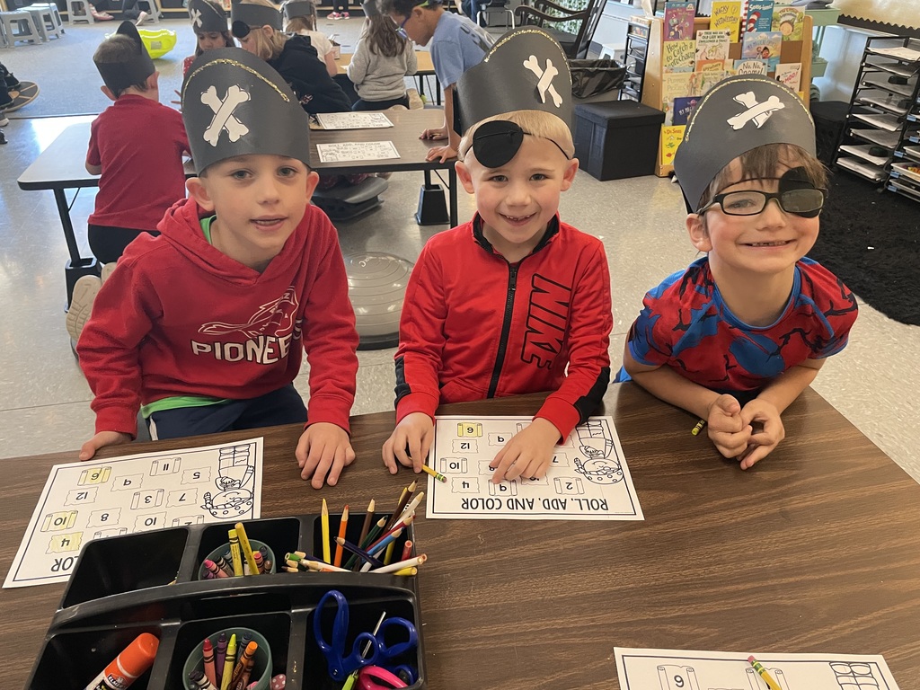3 boys working on a treasure map