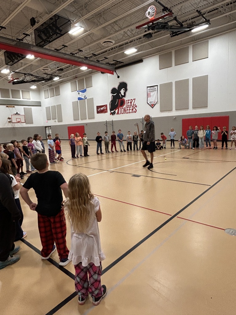 dr. dan ninham talking to children in gym