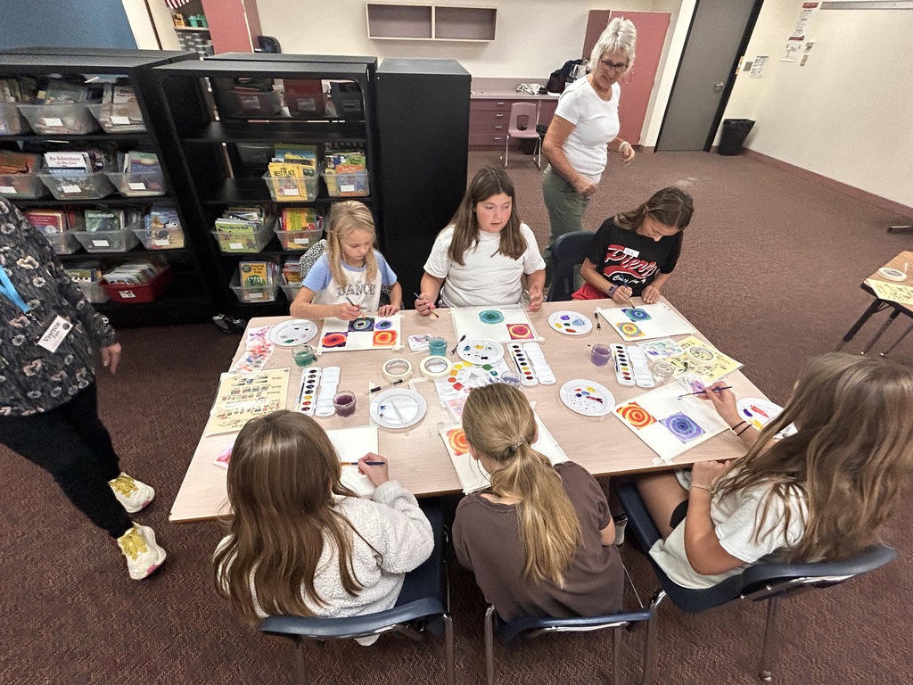 students painting watercolor circles