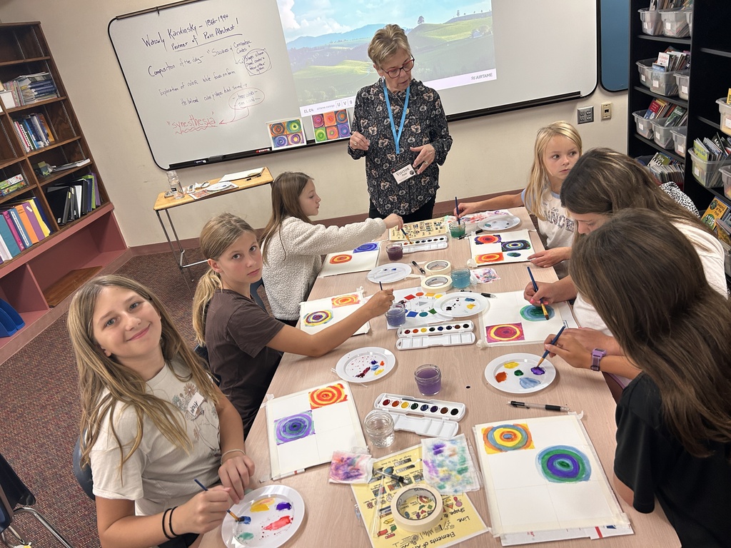 students painting watercolor circles