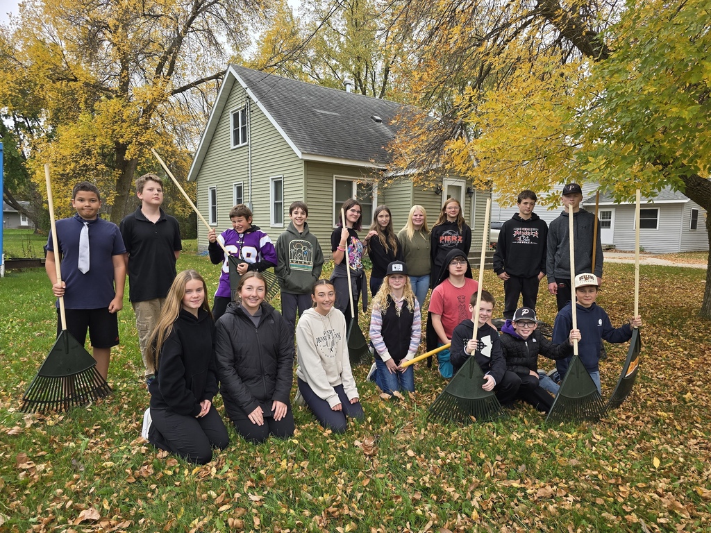 kids raking leaves