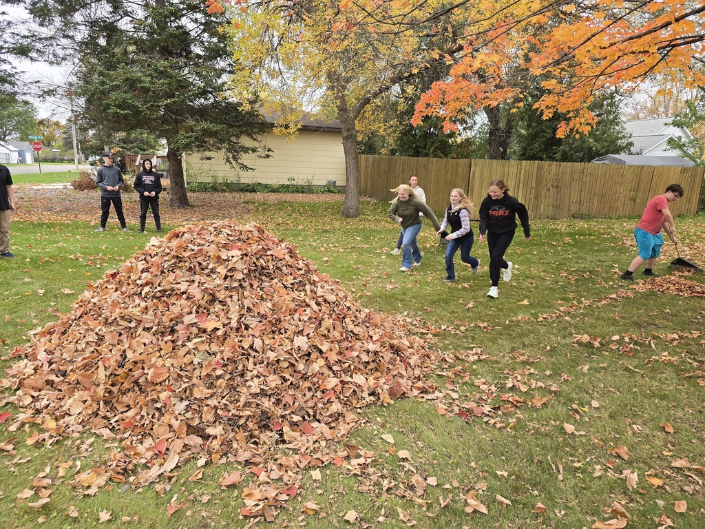 kids raking leaves