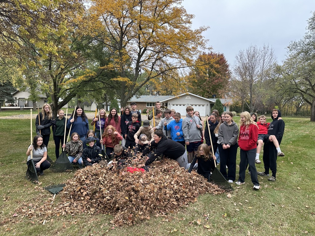 kids raking leaves