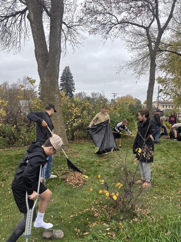 kids raking leaves