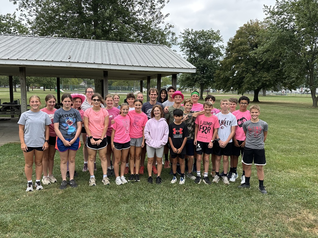 Professional runner talking to a cross country team