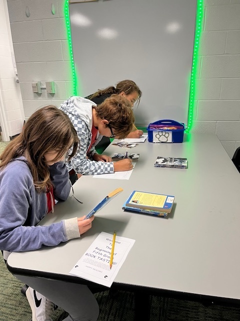 students reading a book