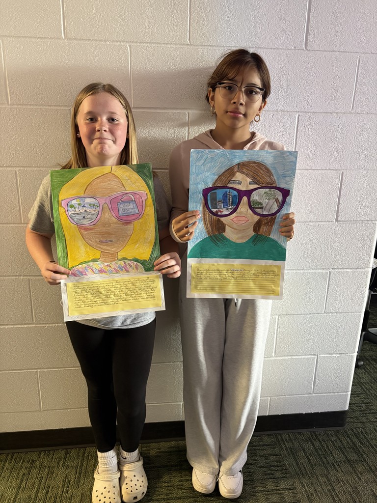Students posing with their art work