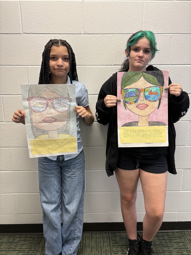Students posing with their art work