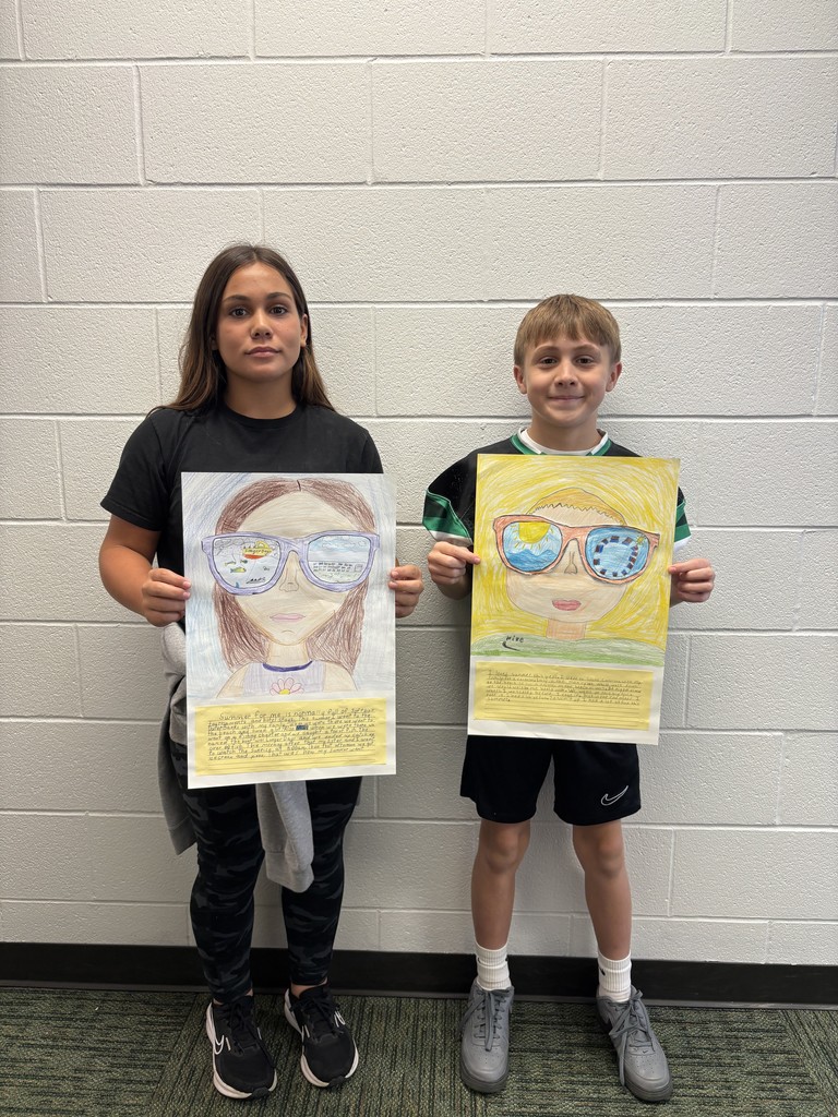 Students posing with their art work