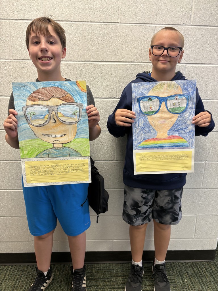 Students posing with their art work