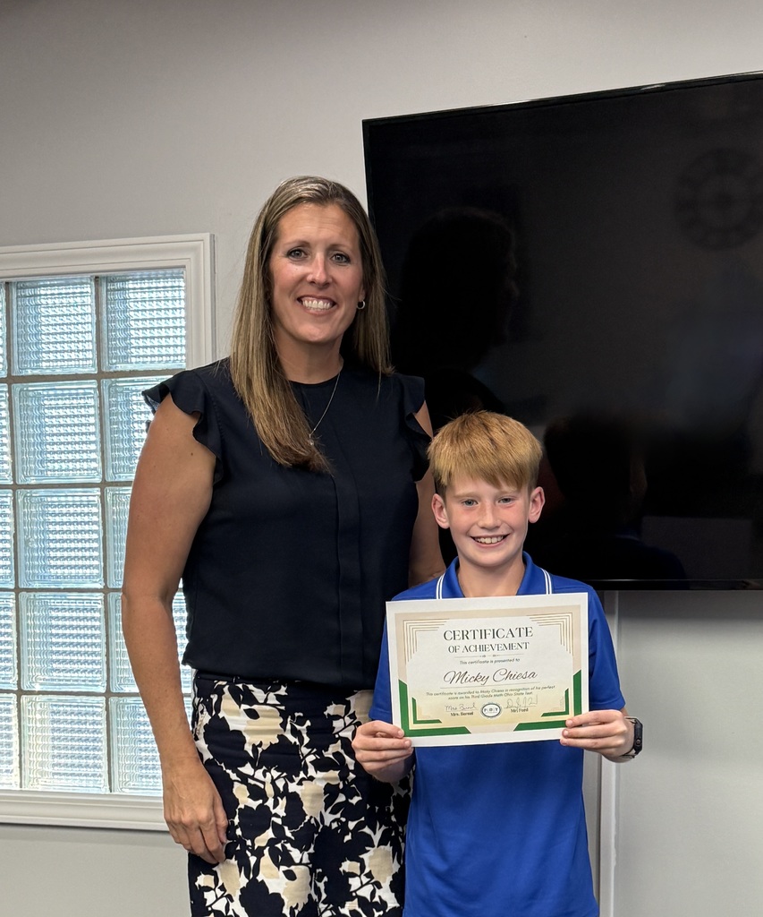 student posing with a certificate