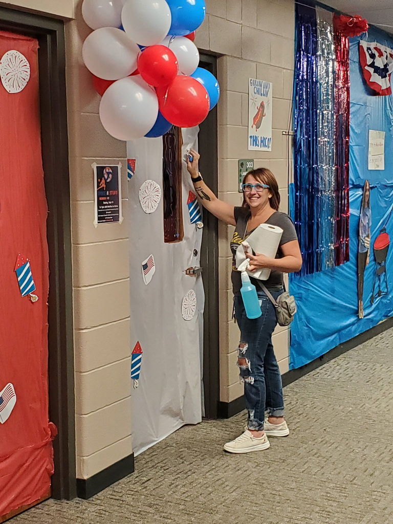 lady hanging up balloons