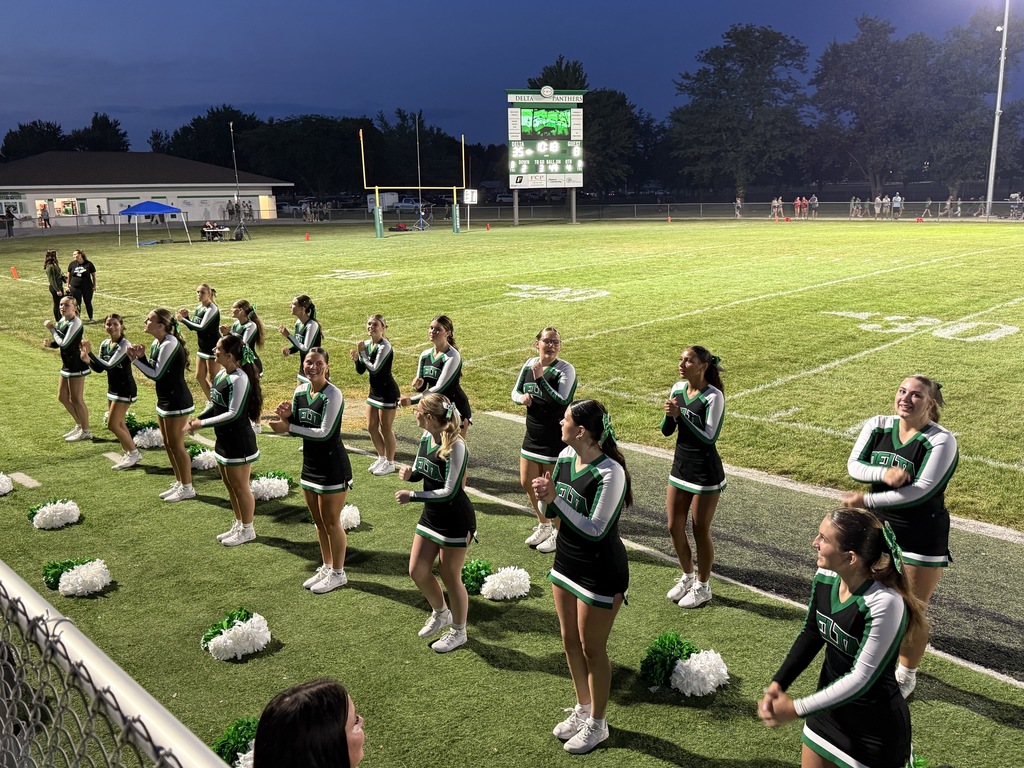 Cheerleaders on a football field