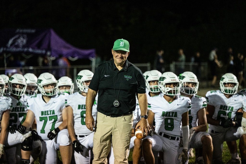 football coach with his team