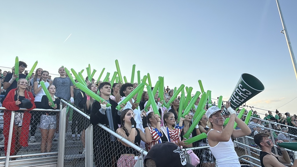 students cheering at a football game