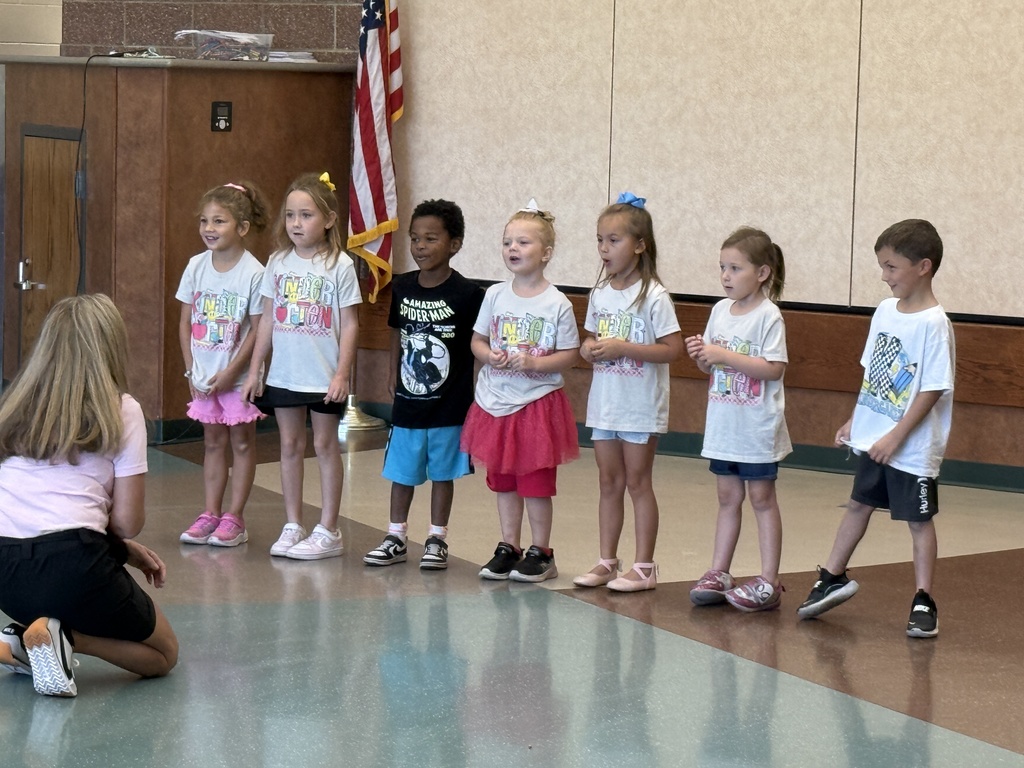 Students performing in a school