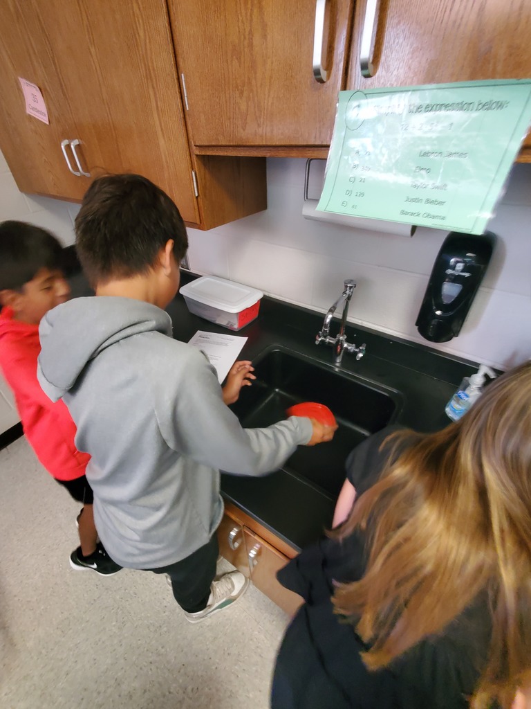 students shaking butter in a lab