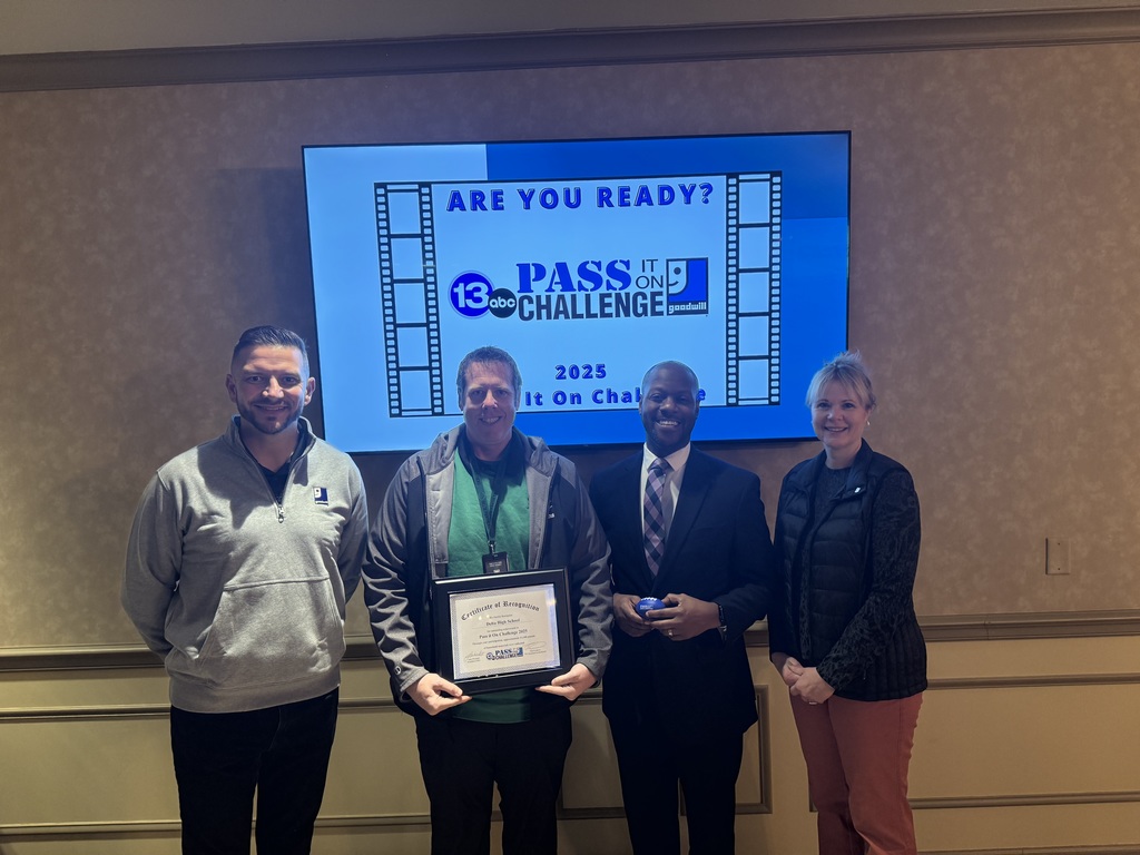 Photo of our Athletic Director accepting our award