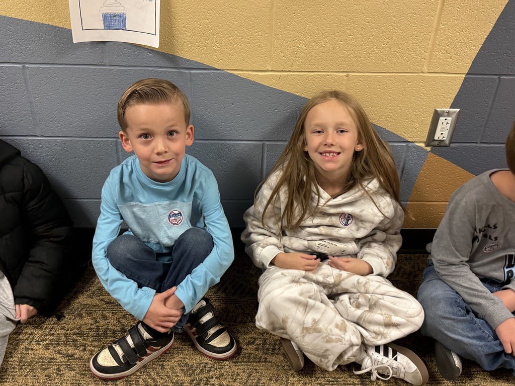 students posing with their I voted stickers