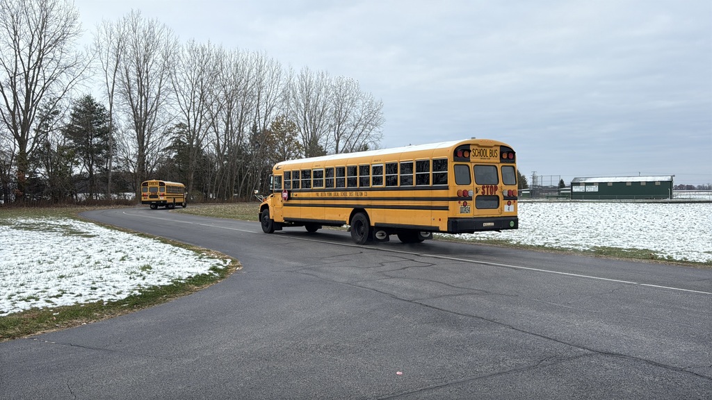 students loading the bus for camp