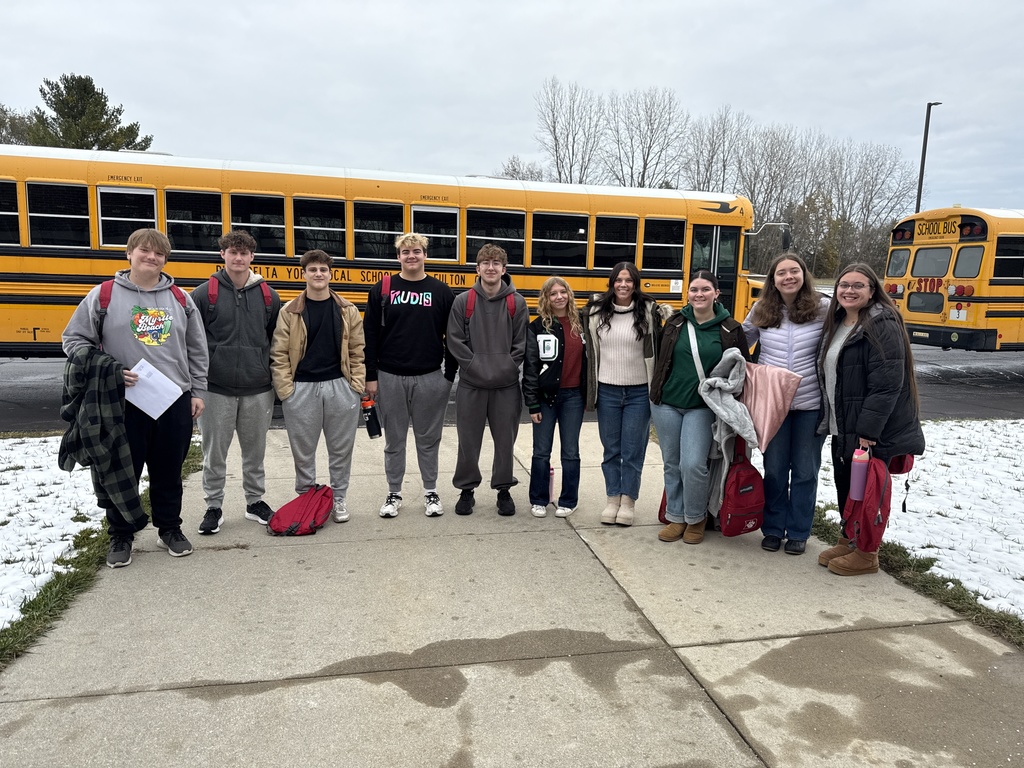 students loading the bus for camp