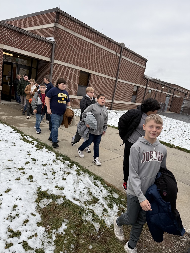 students loading the bus for camp