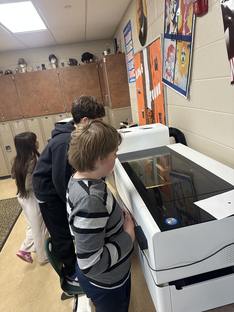 student posing with a Christmas ornament