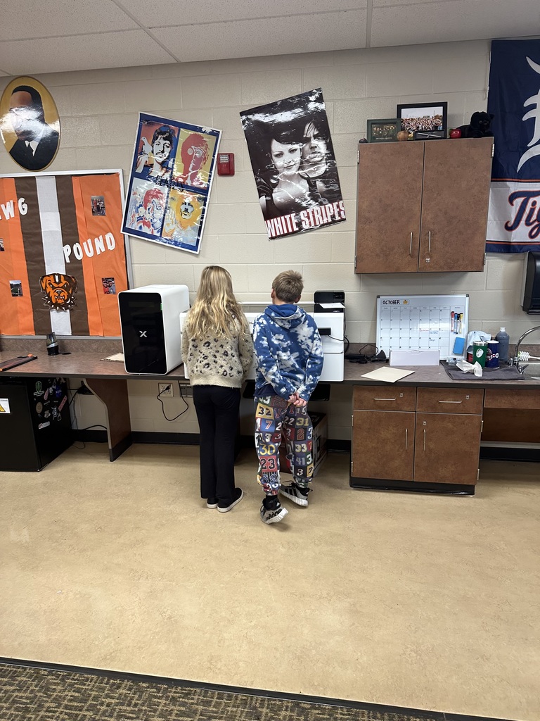 student posing with a Christmas ornament
