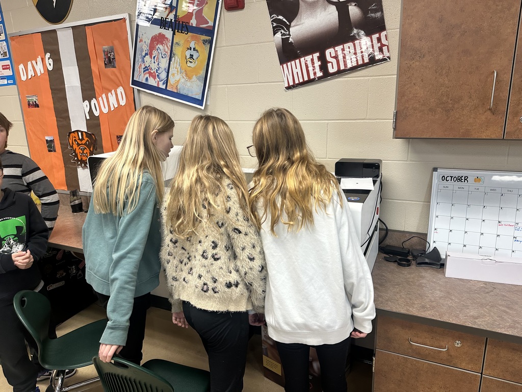 student posing with a Christmas ornament