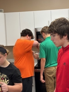 students making smores in the kitchen lab