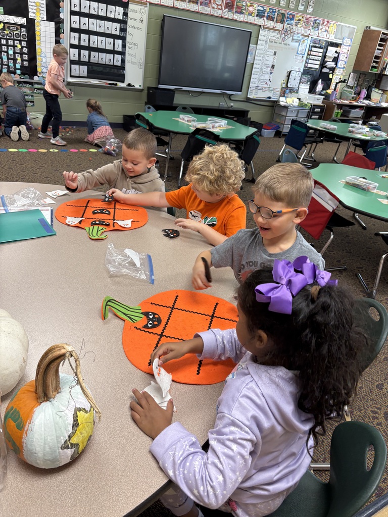 students playing in a classroom