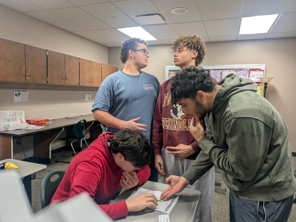 HS students working through an escape room in class