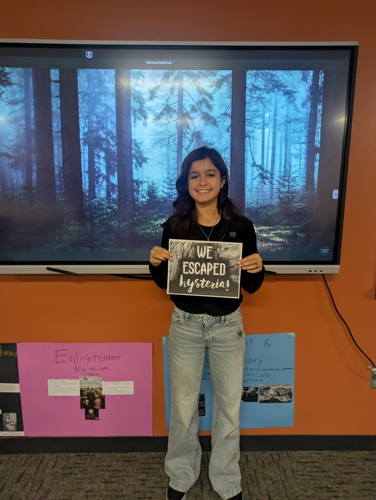 HS students working through an escape room in class