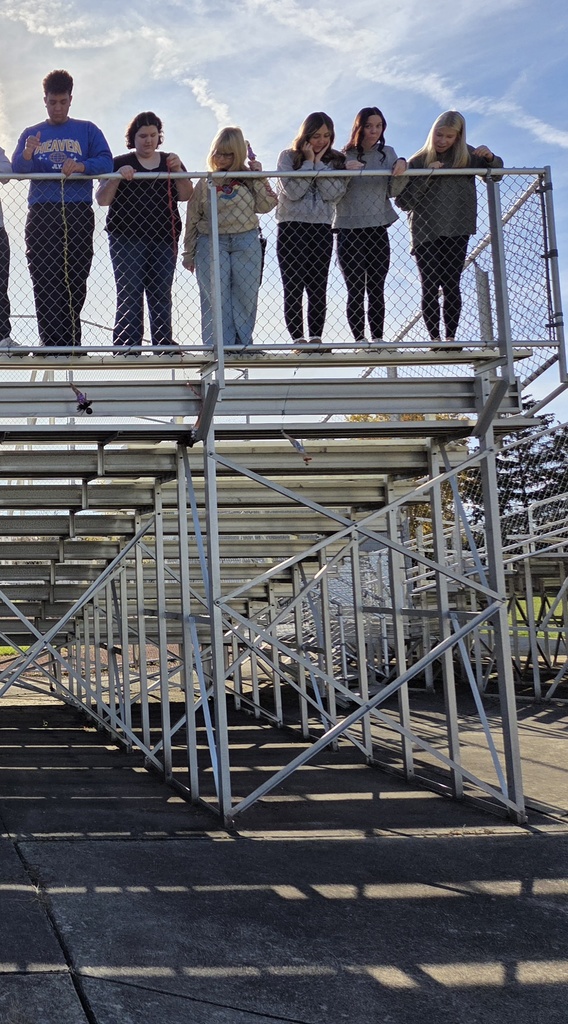 Students participating in a bungee drop