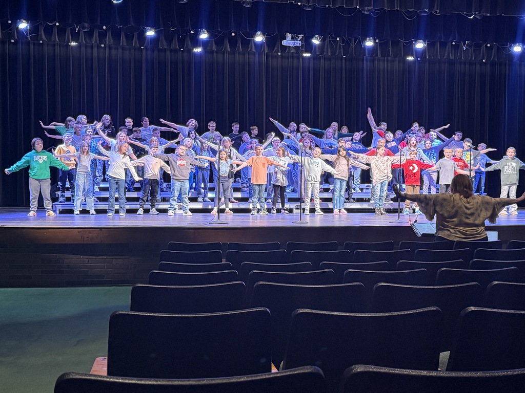 Students performing on stage