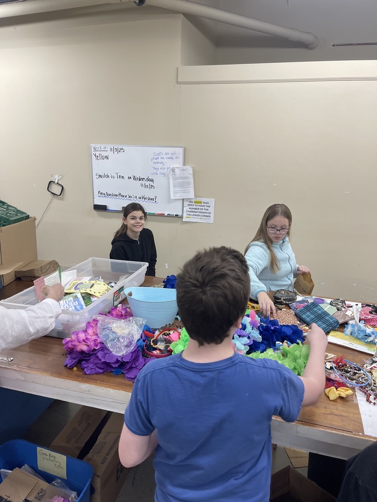 Students helping set up the Christmas shop