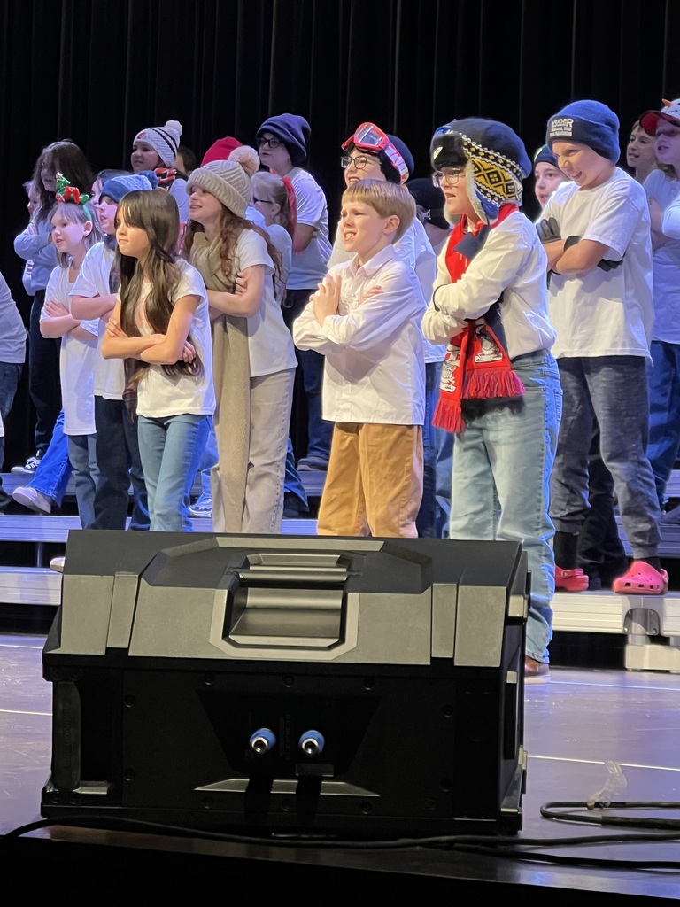 Students performing on a stage