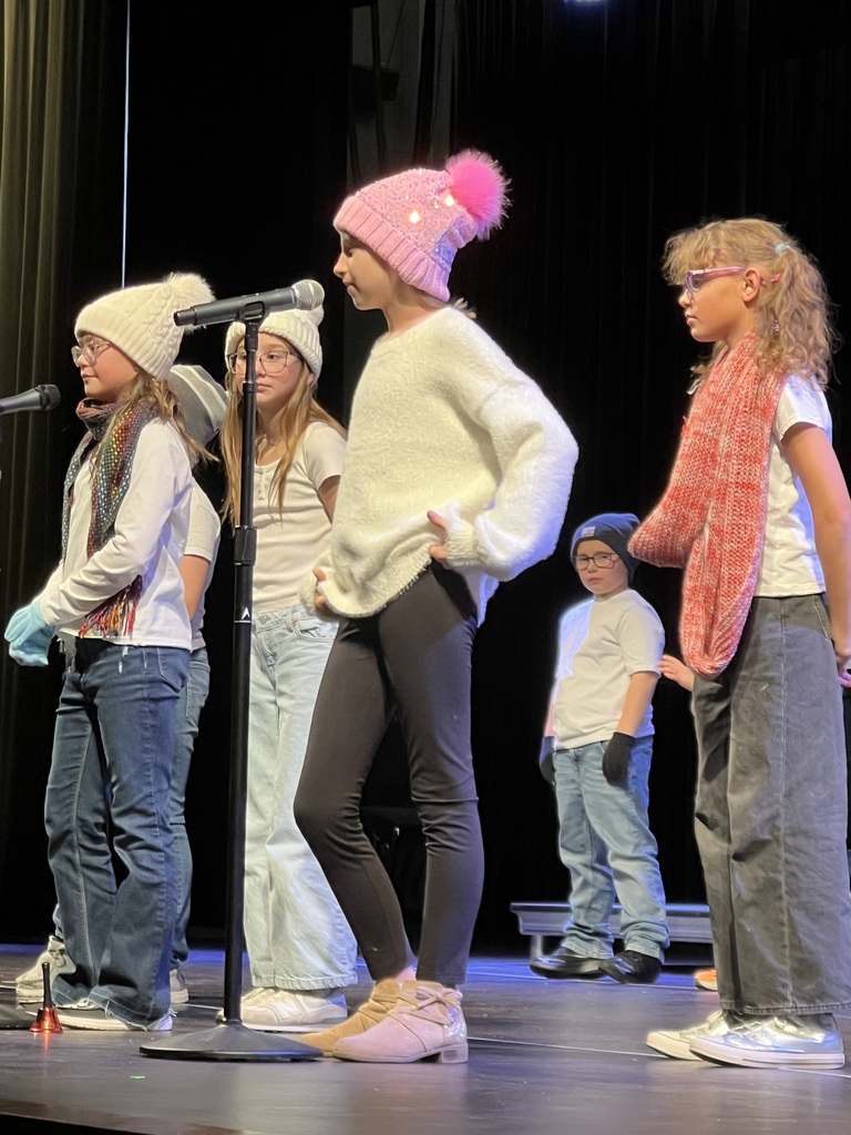 Students performing on a stage