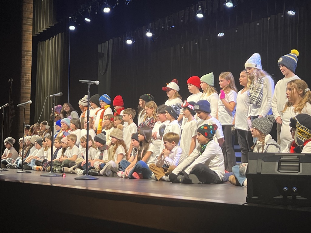 Students performing on a stage